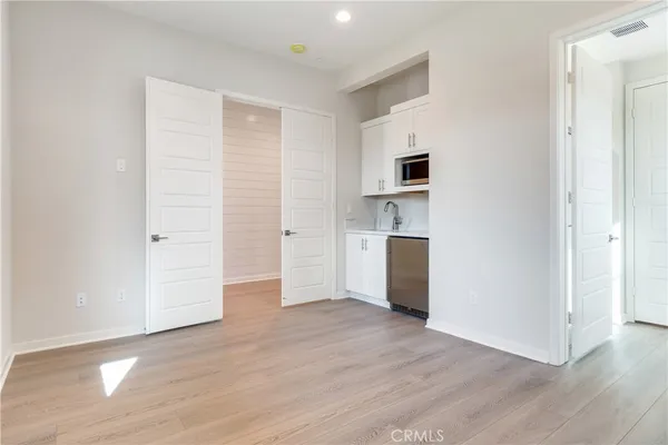 a kitchen with a sink and a microwave