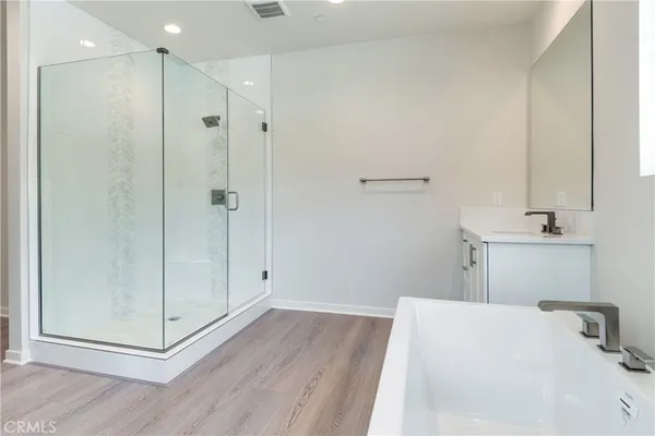 a bathroom with a bathtub and a sink