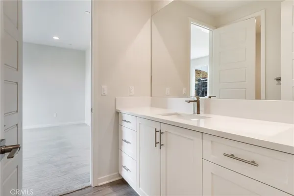 a white toilet sitting next to a bath tub