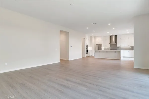 a view of kitchen with wooden floor