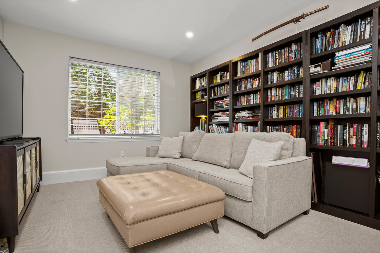 1 Shore Road, Unit 9 Stamford, CT 06902 - Photo 13 of 27 a living room with furniture and a book shelf