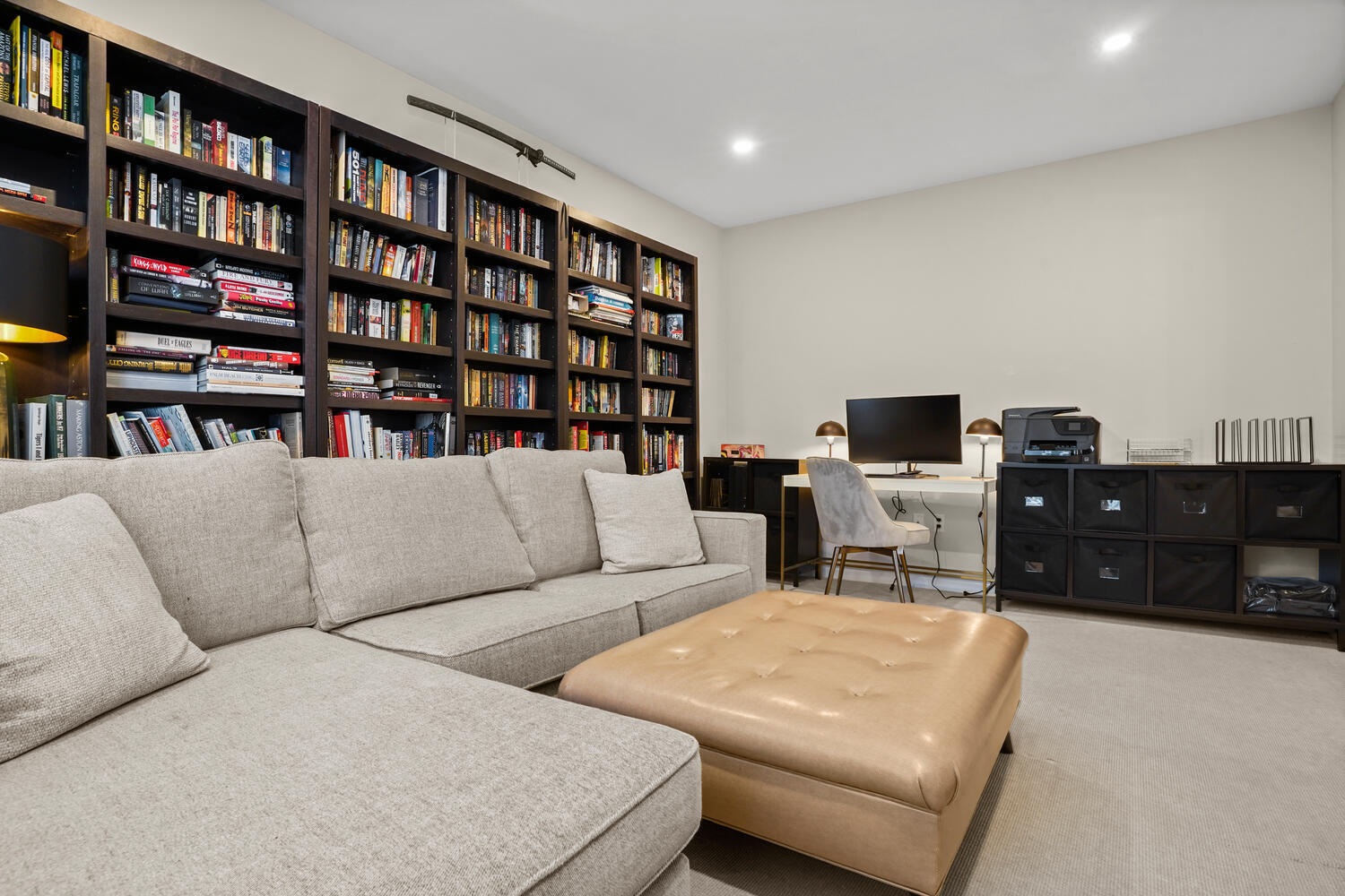 1 Shore Road, Unit 9 Stamford, CT 06902 - Photo 14 of 27 a living room with furniture and a book shelf