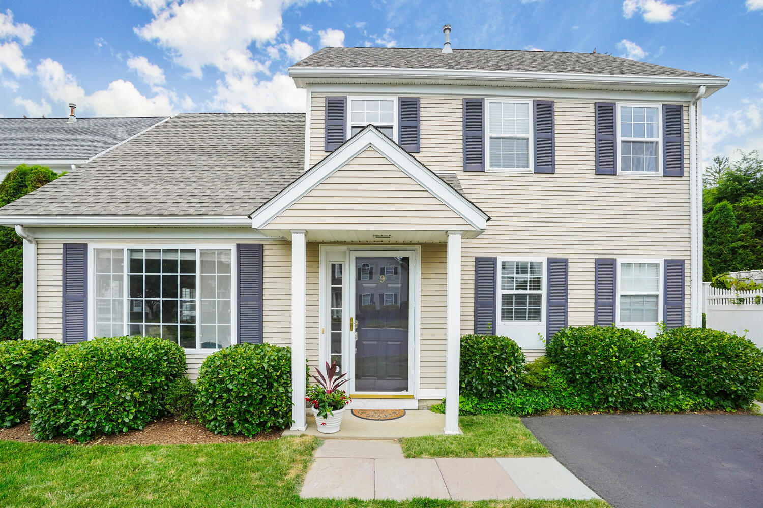 1 Shore Road, Unit 9 Stamford, CT 06902 - Photo 27 of 27 a front view of a house with yard and green space