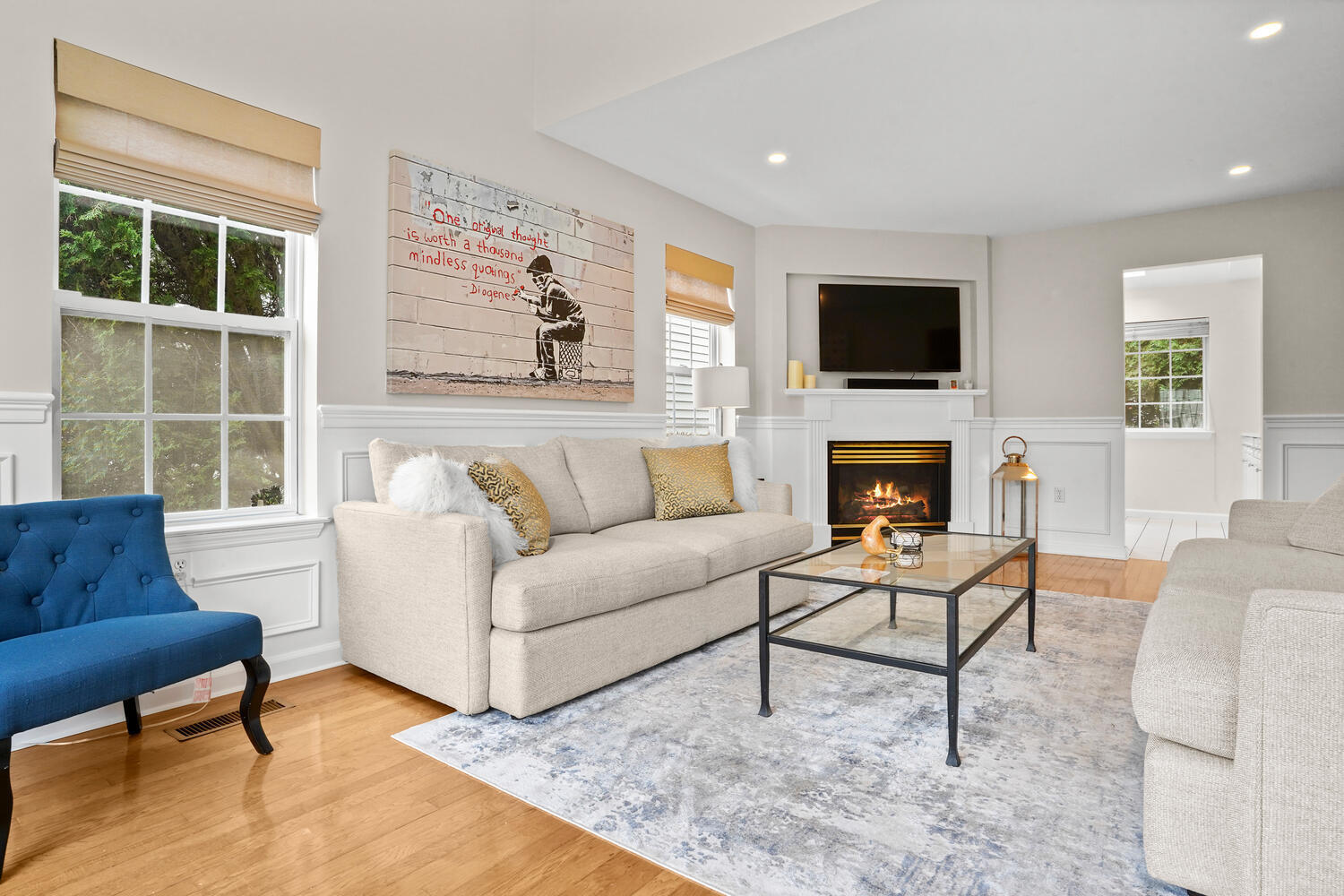 1 Shore Road, Unit 9 Stamford, CT 06902 - Photo 3 of 27 a living room with furniture a flat screen tv and a fireplace