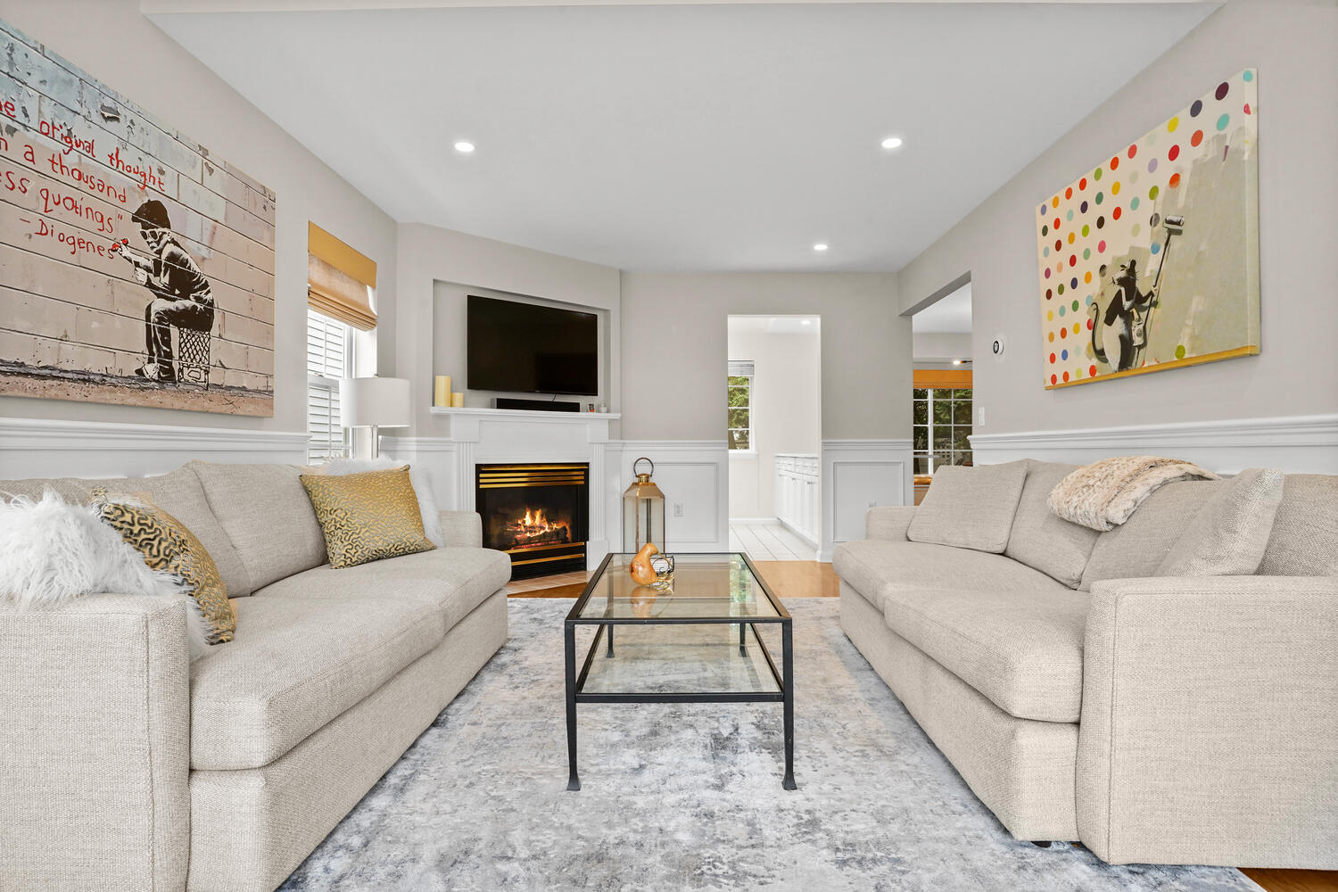 1 Shore Road, Unit 9 Stamford, CT 06902 - Photo 4 of 27 a living room with furniture a flat screen tv and a fireplace