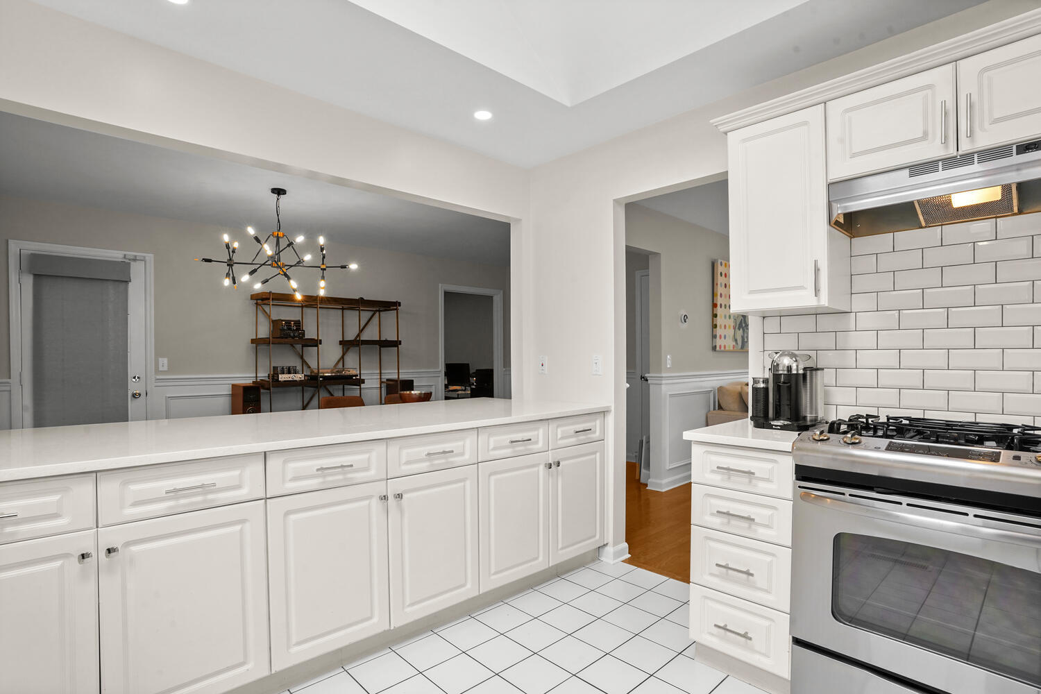1 Shore Road, Unit 9 Stamford, CT 06902 - Photo 9 of 27 a kitchen with white cabinets and appliances