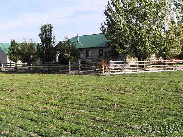 675 S Road Mack, CO 81525 - Photo 13 of 27 a house view with swimming pool in front of it