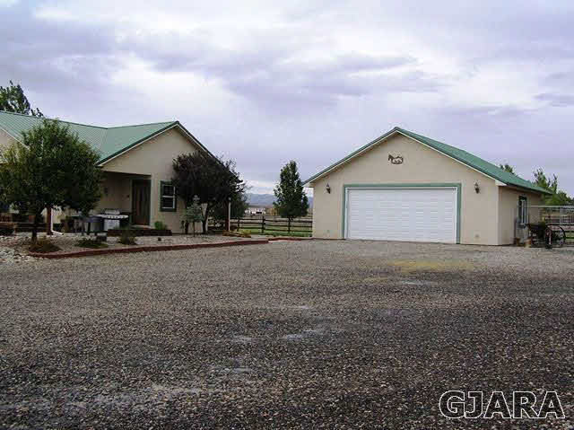 675 S Road Mack, CO 81525 - Photo 14 of 27 a view of a house with a yard