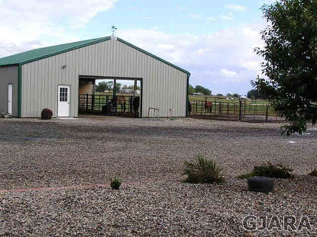 675 S Road Mack, CO 81525 - Photo 15 of 27 a front view of a house with a yard