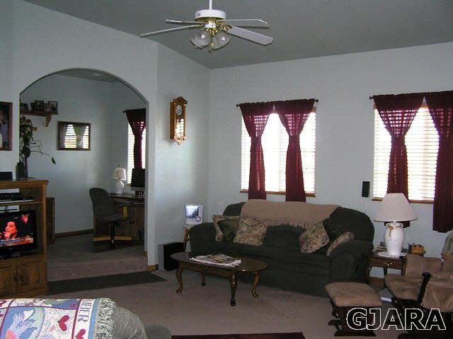675 S Road Mack, CO 81525 - Photo 20 of 27 a bedroom with a bed and a chandelier