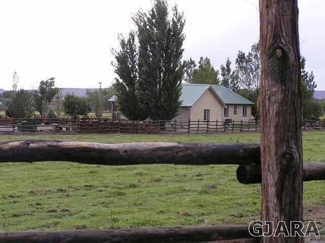 675 S Road Mack, CO 81525 - Photo 22 of 27 a view of house with a yard