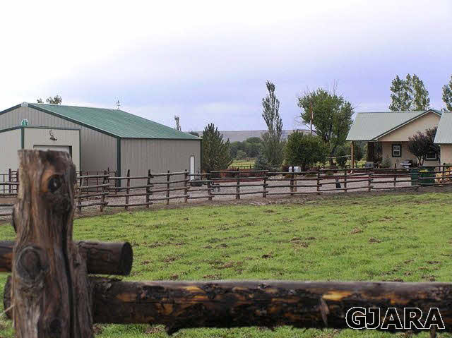 675 S Road Mack, CO 81525 - Photo 23 of 27 a front view of a house with garden