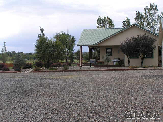 675 S Road Mack, CO 81525 - Photo 24 of 27 a view of a house with backyard