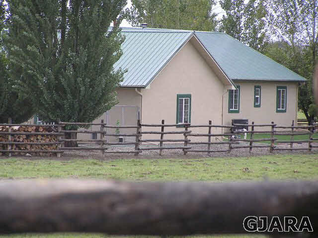 675 S Road Mack, CO 81525 - Photo 3 of 27 a view of a house with a yard