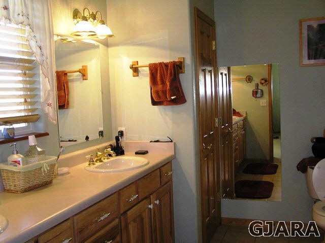 675 S Road Mack, CO 81525 - Photo 4 of 27 a bathroom with a sink and a mirror
