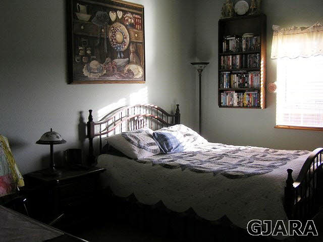 675 S Road Mack, CO 81525 - Photo 5 of 27 a bed sitting in a bedroom next to a window