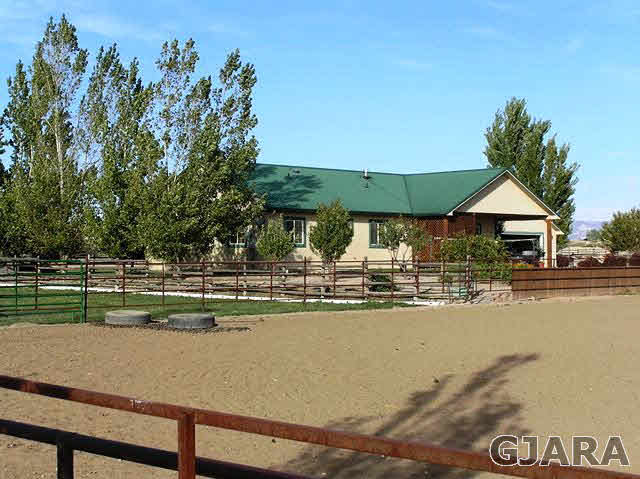 675 S Road Mack, CO 81525 - Photo 8 of 27 a view of swimming pool with table and chairs under an umbrella