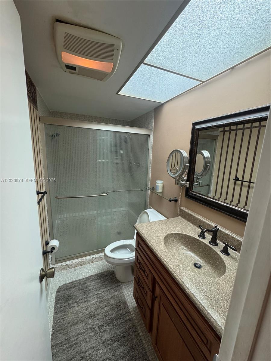 6731 Cypress Road, Unit 410 Plantation, FL 33317 - Photo 3 of 15 a bathroom with a sink toilet and shower