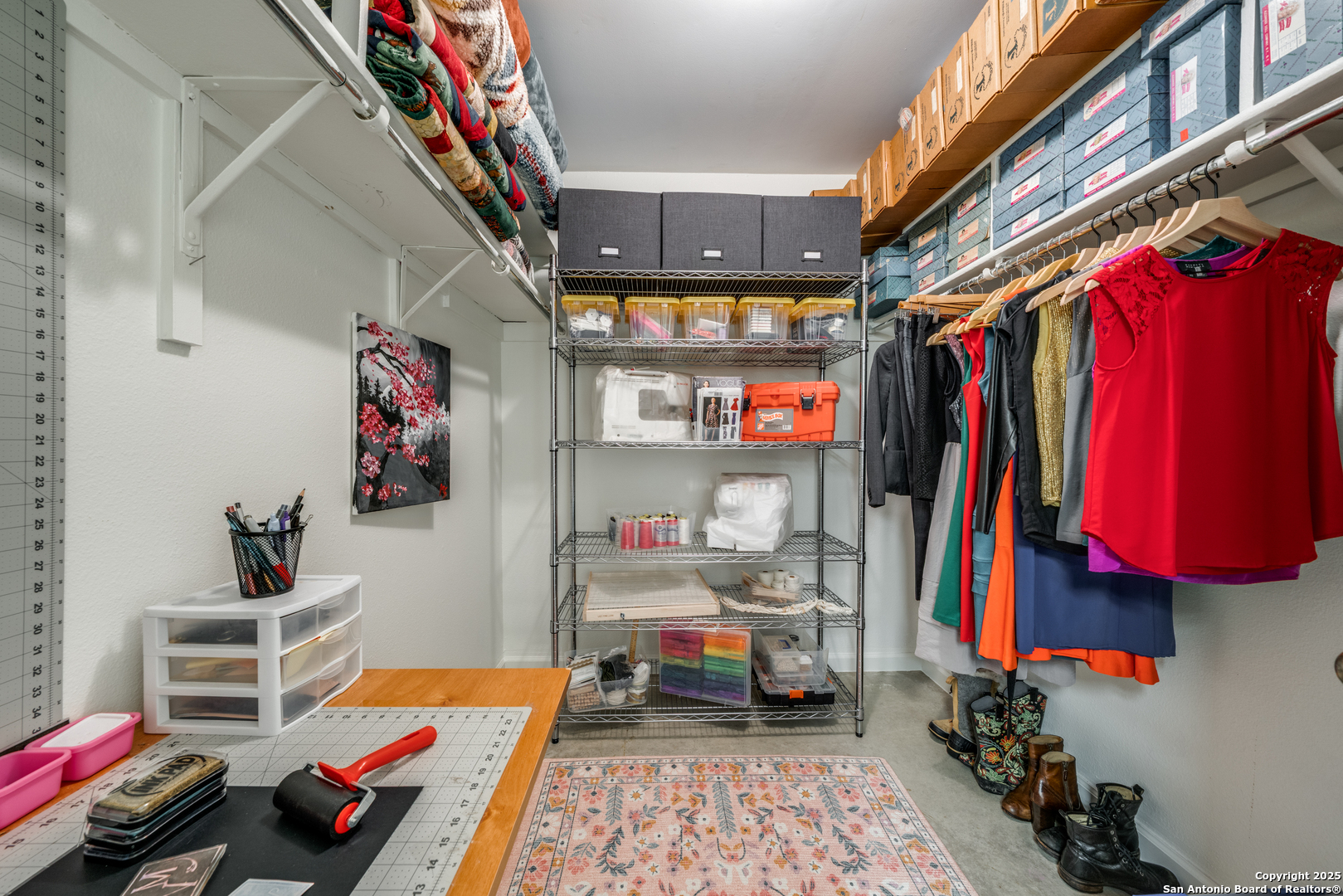 7738 Chambers Road, Unit 903 San Antonio, TX 78229 - Photo 16 of 22 a view of walk in closet with clothes and shoes