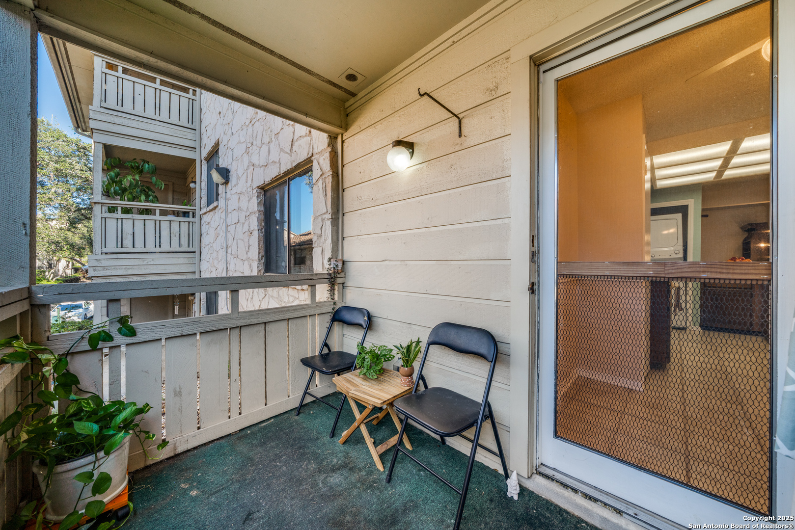 7738 Chambers Road, Unit 903 San Antonio, TX 78229 - Photo 18 of 22 a view of a chair and table in the balcony