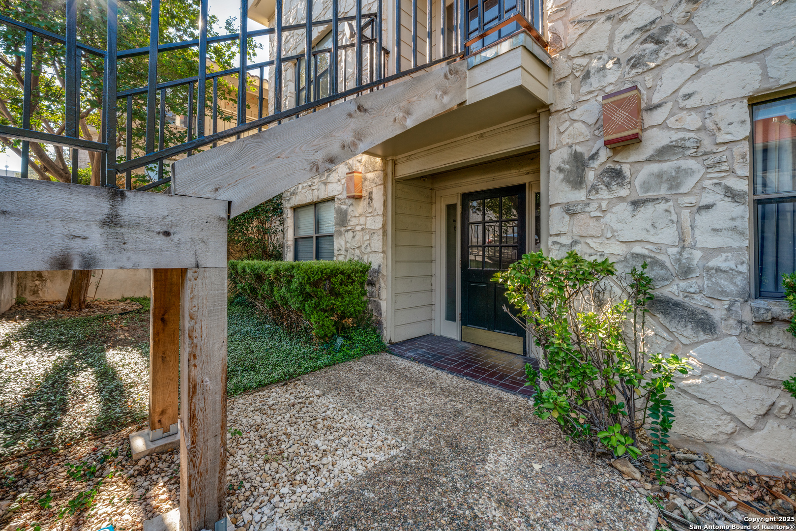 7738 Chambers Road, Unit 903 San Antonio, TX 78229 - Photo 19 of 22 a front view of a house with garden