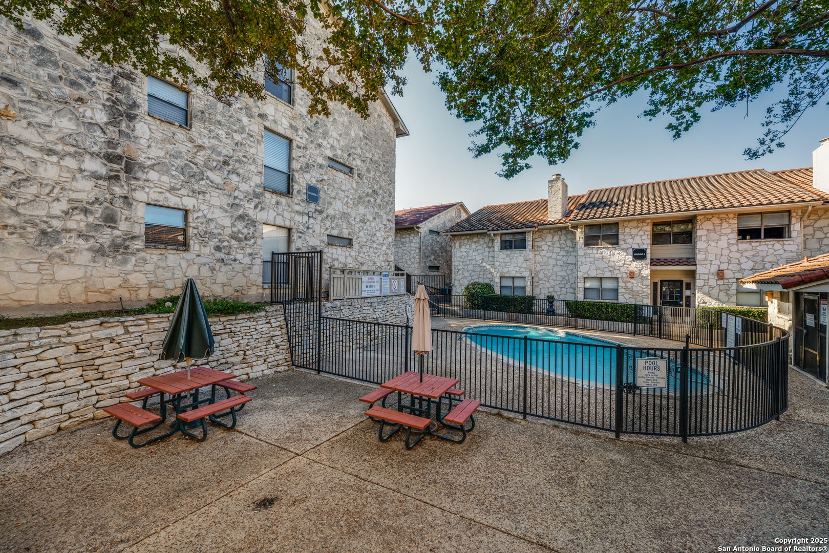 7738 Chambers Road, Unit 903 San Antonio, TX 78229 - Photo 22 of 22 a backyard of a house with outdoor seating