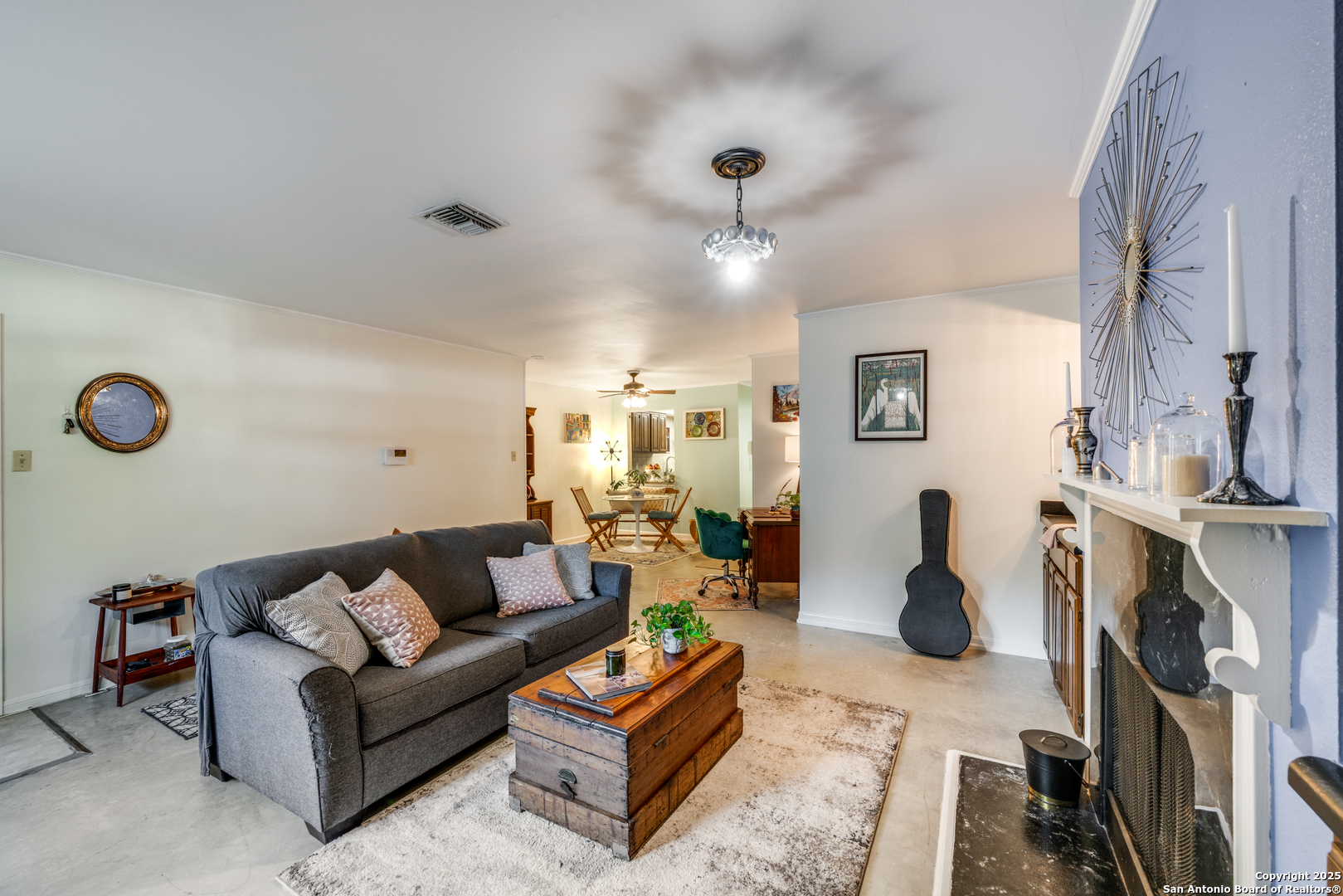 7738 Chambers Road, Unit 903 San Antonio, TX 78229 - Photo 5 of 22 a living room with furniture a rug and a large window