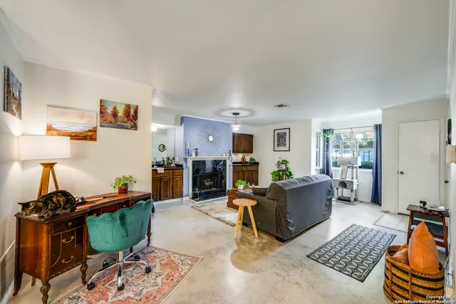 a living room with furniture and a window