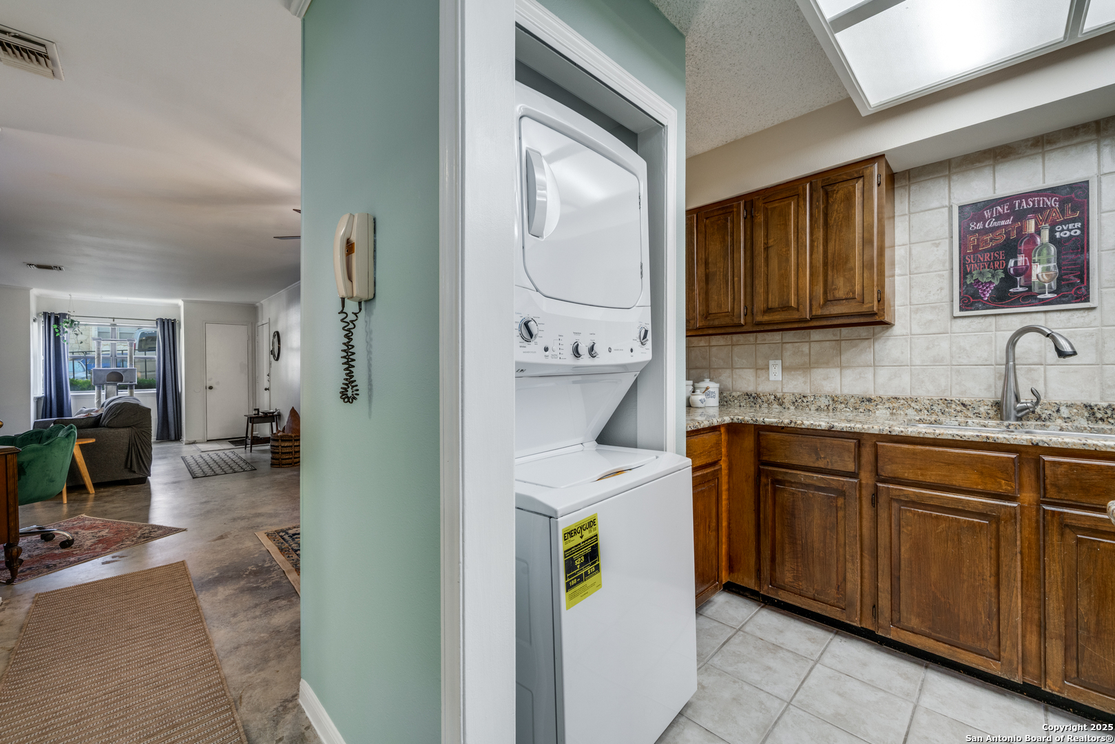 7738 Chambers Road, Unit 903 San Antonio, TX 78229 - Photo 8 of 22 a kitchen with stainless steel appliances granite countertop a refrigerator and a stove top oven