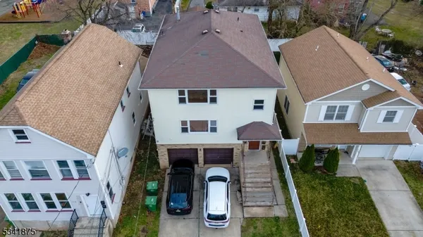 an aerial view of a house with yard