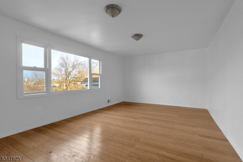 1129 Spruce Street Roselle, NJ 07203 - Photo 8 of 18 an empty room with windows