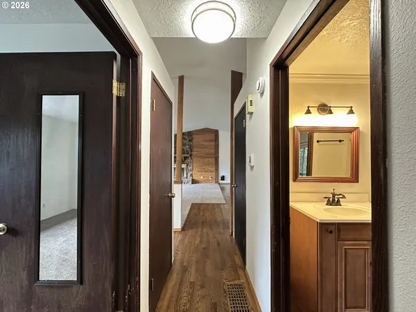 a view of a bathroom from a hallway