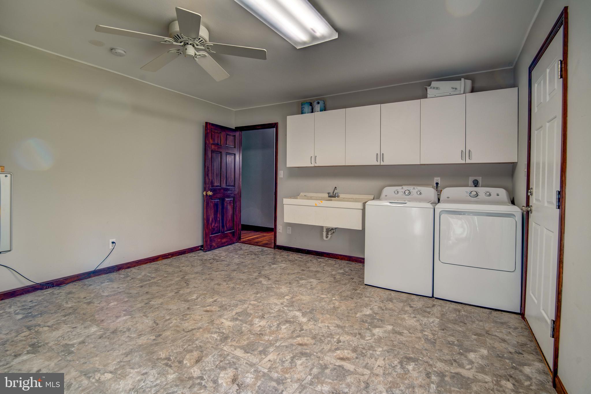 49530 Will's Road Dameron, MD 20628 - Photo 25 of 51 a view of a utility room with closet dryer and washer