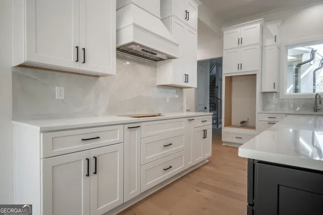 a kitchen with cabinets stainless steel appliances and cabinets
