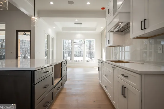 a view of a livingroom with a window and a ceiling fan
