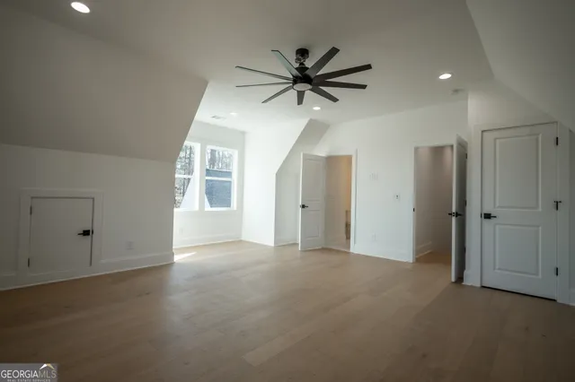 an empty room with an entryway and window