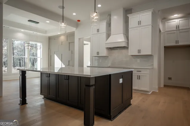 a large bathroom with a large tub and sink