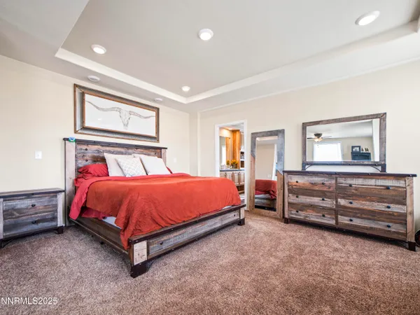 a bed sitting in a room next to a window