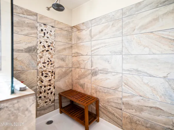 a view of a bench in wooden floor