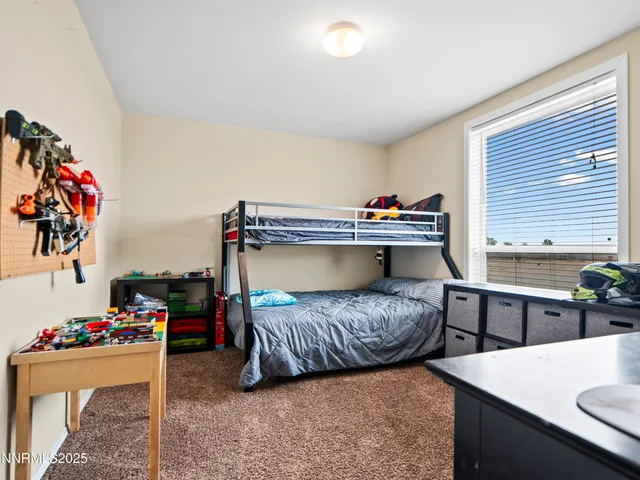 a bedroom with a bed and a table