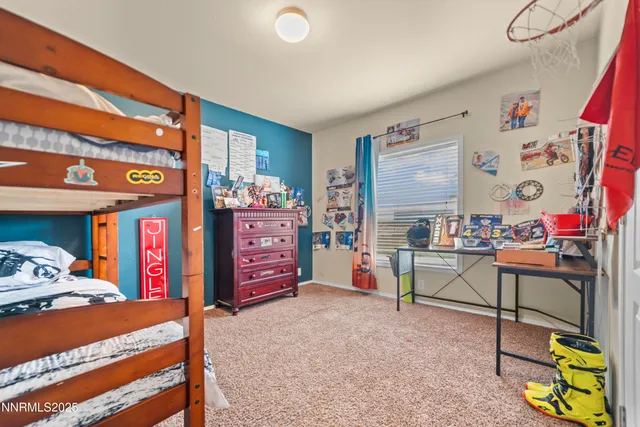 a bed room with a bed and a desk