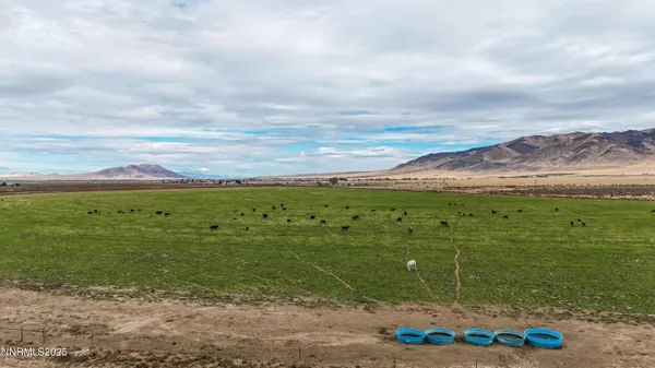 a view of house with outdoor space and lake view