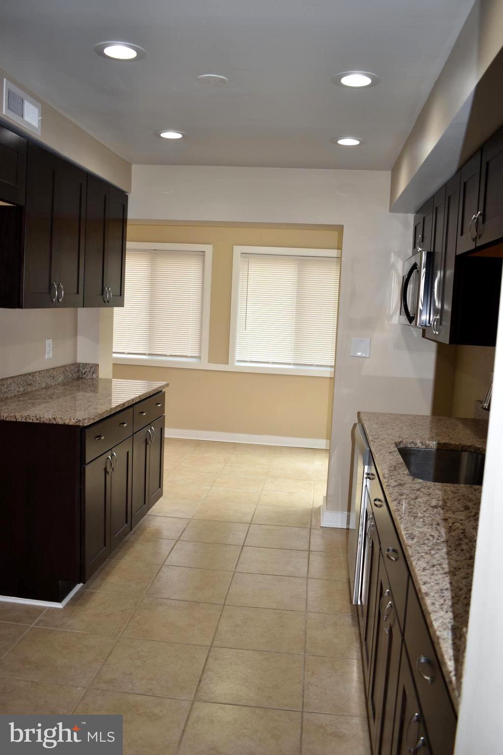 7013 Plymouth Road Baltimore, MD 21208 - Photo 8 of 36 Kitchen Opens To Family Room