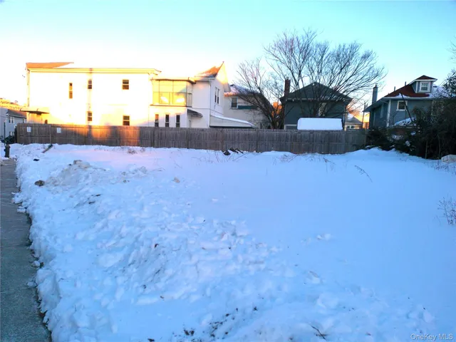 a view of a yard covered with snow