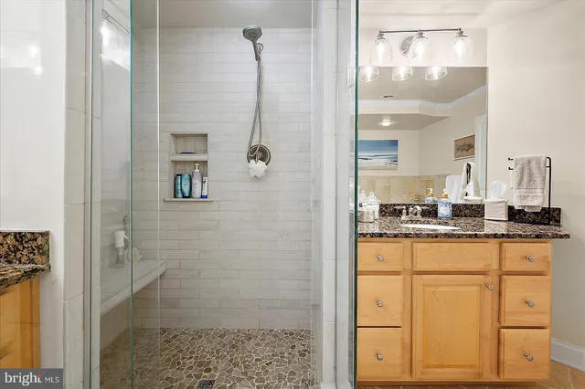 a bathroom with a toilet a sink and a mirror