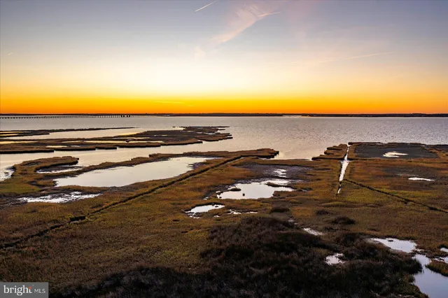 a view of a tall building next to a road