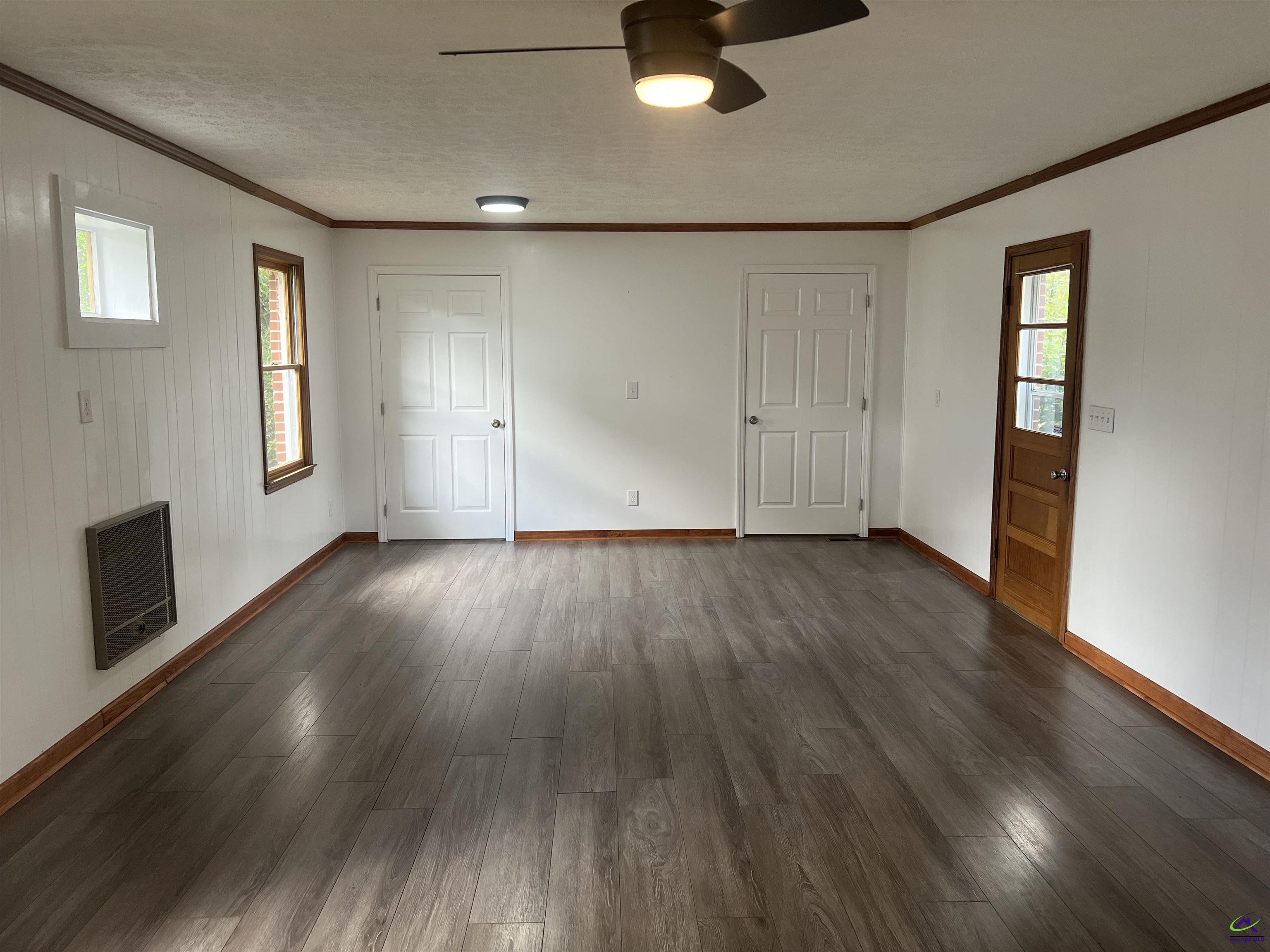 145 South 2nd Street Cochran, GA 31014 - Photo 16 of 24 wooden floor in an empty room with a window