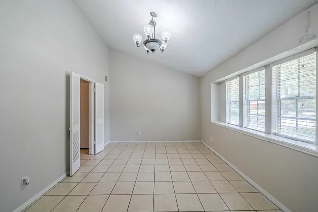 a view of an empty room and window