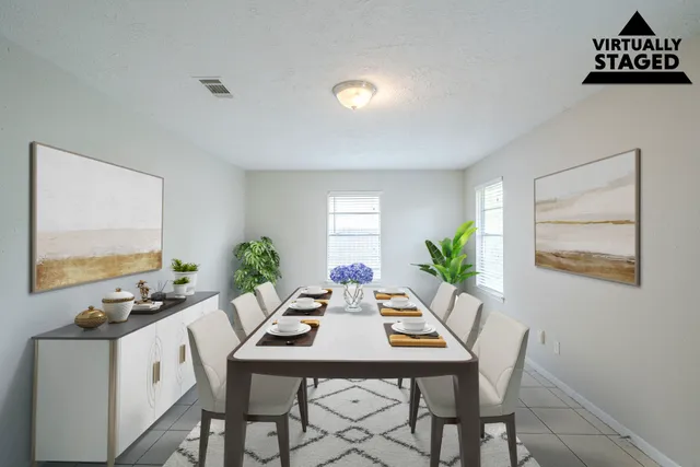 a view of a dining room with furniture and window
