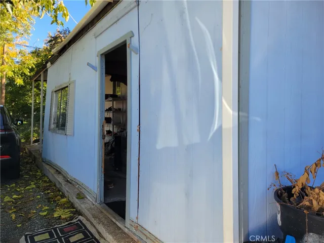 a door view with wooden fencing